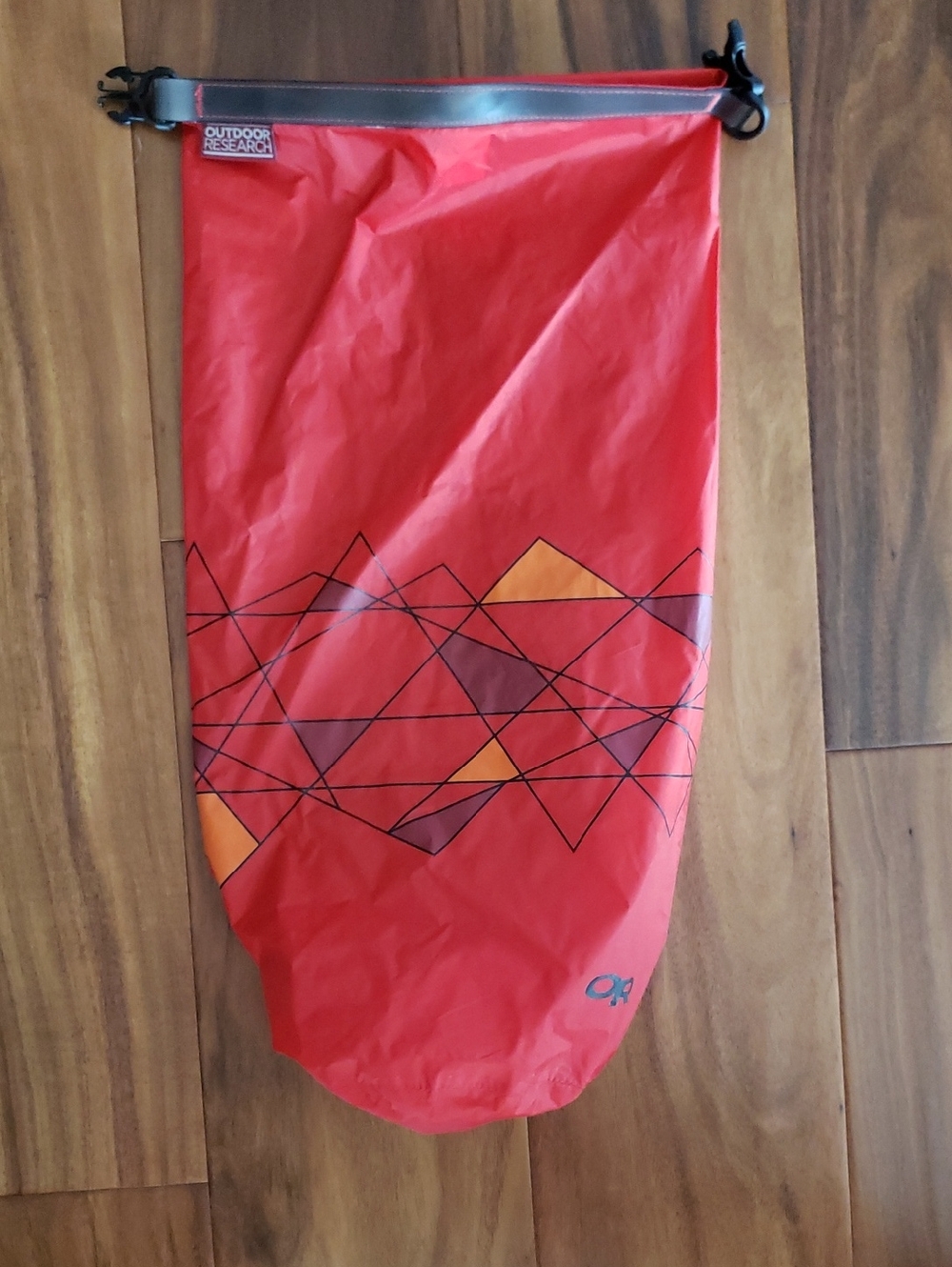 Outdoor Research Red 10L Dry Sack with Orange and Maroon Geometric Accents